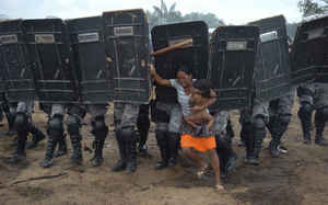 Woman tries to stop forced eviction of her people, Manaus, Brazil, March 10 (General News, Luis Vasconcelos, A Critica - Zuma Press, 2008)